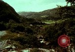 Image of Irish farmers digging potatoes Ireland, 1975, second 19 stock footage video 65675039766