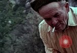 Image of Irish farmers digging potatoes Ireland, 1975, second 54 stock footage video 65675039766