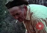 Image of Irish farmers digging potatoes Ireland, 1975, second 56 stock footage video 65675039766
