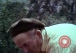 Image of Irish farmers digging potatoes Ireland, 1975, second 57 stock footage video 65675039766