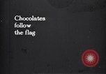 Image of American soldier giving chocolates to children France, 1918, second 1 stock footage video 65675039777