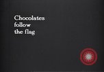 Image of American soldier giving chocolates to children France, 1918, second 3 stock footage video 65675039777