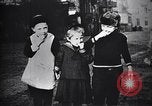 Image of American soldier giving chocolates to children France, 1918, second 31 stock footage video 65675039777