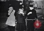 Image of American soldier giving chocolates to children France, 1918, second 32 stock footage video 65675039777
