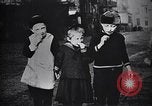 Image of American soldier giving chocolates to children France, 1918, second 33 stock footage video 65675039777