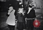 Image of American soldier giving chocolates to children France, 1918, second 34 stock footage video 65675039777