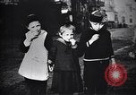 Image of American soldier giving chocolates to children France, 1918, second 35 stock footage video 65675039777