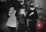 Image of American soldier giving chocolates to children France, 1918, second 36 stock footage video 65675039777