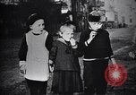 Image of American soldier giving chocolates to children France, 1918, second 37 stock footage video 65675039777