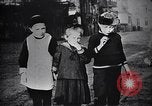Image of American soldier giving chocolates to children France, 1918, second 38 stock footage video 65675039777