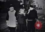 Image of American soldier giving chocolates to children France, 1918, second 39 stock footage video 65675039777