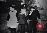 Image of American soldier giving chocolates to children France, 1918, second 40 stock footage video 65675039777