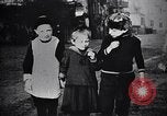Image of American soldier giving chocolates to children France, 1918, second 41 stock footage video 65675039777