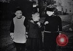 Image of American soldier giving chocolates to children France, 1918, second 42 stock footage video 65675039777
