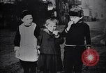 Image of American soldier giving chocolates to children France, 1918, second 43 stock footage video 65675039777
