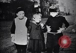 Image of American soldier giving chocolates to children France, 1918, second 45 stock footage video 65675039777