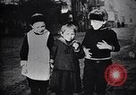 Image of American soldier giving chocolates to children France, 1918, second 46 stock footage video 65675039777