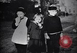 Image of American soldier giving chocolates to children France, 1918, second 47 stock footage video 65675039777