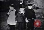 Image of American soldier giving chocolates to children France, 1918, second 48 stock footage video 65675039777