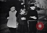 Image of American soldier giving chocolates to children France, 1918, second 50 stock footage video 65675039777