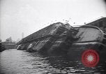 Image of SS Normandie capsized at dock New York City USA, 1943, second 18 stock footage video 65675039822