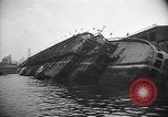 Image of SS Normandie capsized at dock New York City USA, 1943, second 19 stock footage video 65675039822