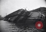 Image of SS Normandie capsized at dock New York City USA, 1943, second 20 stock footage video 65675039822
