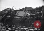 Image of SS Normandie capsized at dock New York City USA, 1943, second 23 stock footage video 65675039822