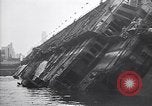Image of SS Normandie capsized at dock New York City USA, 1943, second 26 stock footage video 65675039822