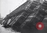 Image of SS Normandie capsized at dock New York City USA, 1943, second 27 stock footage video 65675039822