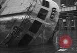 Image of SS Normandie capsized at dock New York City USA, 1943, second 35 stock footage video 65675039822