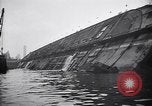Image of SS Normandie capsized at dock New York City USA, 1943, second 46 stock footage video 65675039822