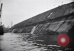 Image of SS Normandie capsized at dock New York City USA, 1943, second 47 stock footage video 65675039822