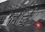 Image of SS Normandie capsized at dock New York City USA, 1943, second 49 stock footage video 65675039822