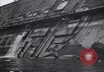 Image of SS Normandie capsized at dock New York City USA, 1943, second 50 stock footage video 65675039822