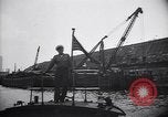 Image of SS Normandie capsized at dock New York City USA, 1943, second 62 stock footage video 65675039822
