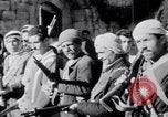 Image of Armed Arab civilian militia brandishing weapons Tripoli Libya, 1962, second 7 stock footage video 65675039880