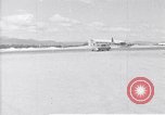 Standbild Krankenwagen transportiert Patienten Flugplatz Guatemala, 1954, aus Sekunde 3 historischem Filmmaterial Videoclip 65675039889