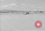 Standbild Krankenwagen transportiert Patienten Flugplatz Guatemala, 1954, aus Sekunde 5 historischem Filmmaterial Videoclip 65675039889