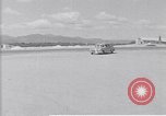 Standbild Krankenwagen transportiert Patienten Flugplatz Guatemala, 1954, aus Sekunde 6 historischem Filmmaterial Videoclip 65675039889