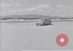 Standbild Krankenwagen transportiert Patienten Flugplatz Guatemala, 1954, aus Sekunde 8 historischem Filmmaterial Videoclip 65675039889