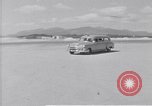 Standbild Krankenwagen transportiert Patienten Flugplatz Guatemala, 1954, aus Sekunde 9 historischem Filmmaterial Videoclip 65675039889