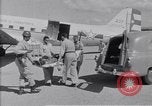 Standbild Krankenwagen transportiert Patienten Flugplatz Guatemala, 1954, aus Sekunde 32 historischem Filmmaterial Videoclip 65675039889