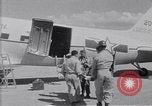 Standbild Krankenwagen transportiert Patienten Flugplatz Guatemala, 1954, aus Sekunde 36 historischem Filmmaterial Videoclip 65675039889