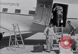Standbild Krankenwagen transportiert Patienten Flugplatz Guatemala, 1954, aus Sekunde 56 historischem Filmmaterial Videoclip 65675039889