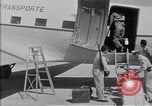 Standbild Krankenwagen transportiert Patienten Flugplatz Guatemala, 1954, aus Sekunde 57 historischem Filmmaterial Videoclip 65675039889