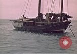 Image of junk or Chinese vessel Southeast Asia, 1962, second 14 stock footage video 65675039900