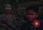 Image of ARVN officer and U.S. Adviser question Vietcong prisoner in Tuy Hoa, S Tuy Hoa South Vietnam, 1962, second 38 stock footage video 65675039921