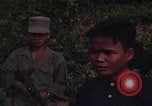 Image of ARVN officer and U.S. Adviser question Vietcong prisoner in Tuy Hoa, S Tuy Hoa South Vietnam, 1962, second 42 stock footage video 65675039921