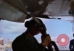 Image of catapult crew prepares to launch aircraft aboard USS Essex (CVA-9) dur Vietnam, 1958, second 12 stock footage video 65675039925